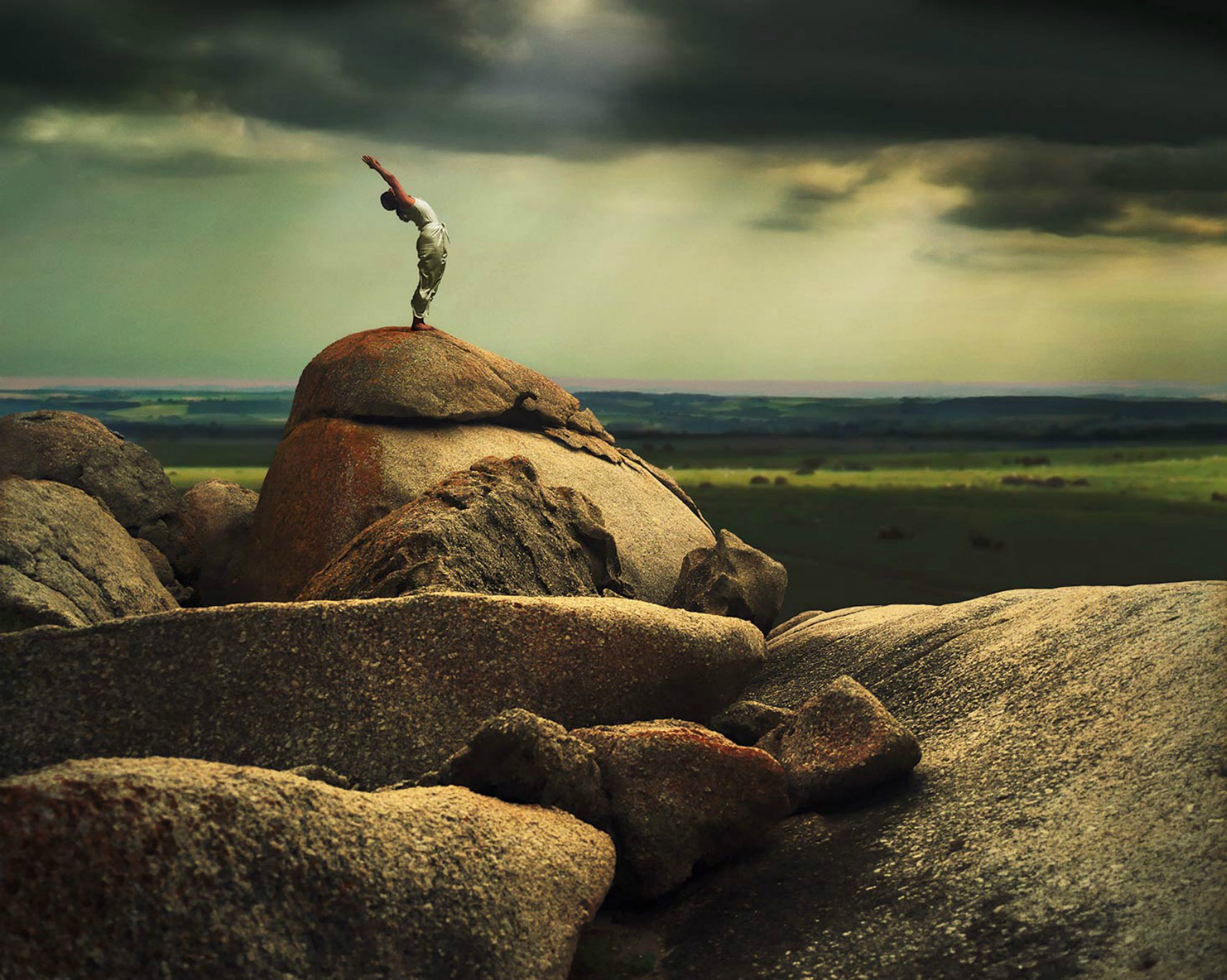 Woman practicing Yoga on Rock. Capetown South Africa